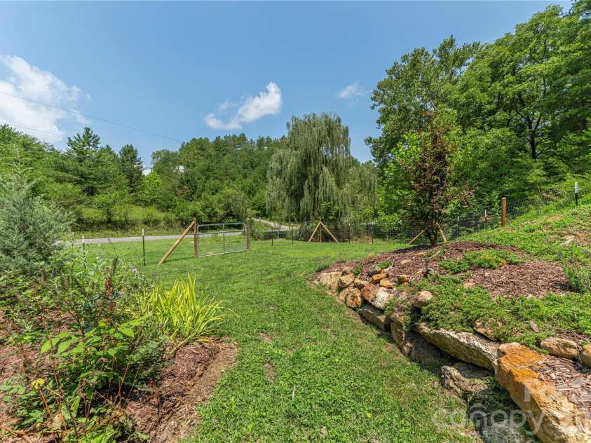 50 Embler Road, Alexander, NC 28701.  MLS# CAR4413083, YatesRealty ID 44048. Mature Landscaping