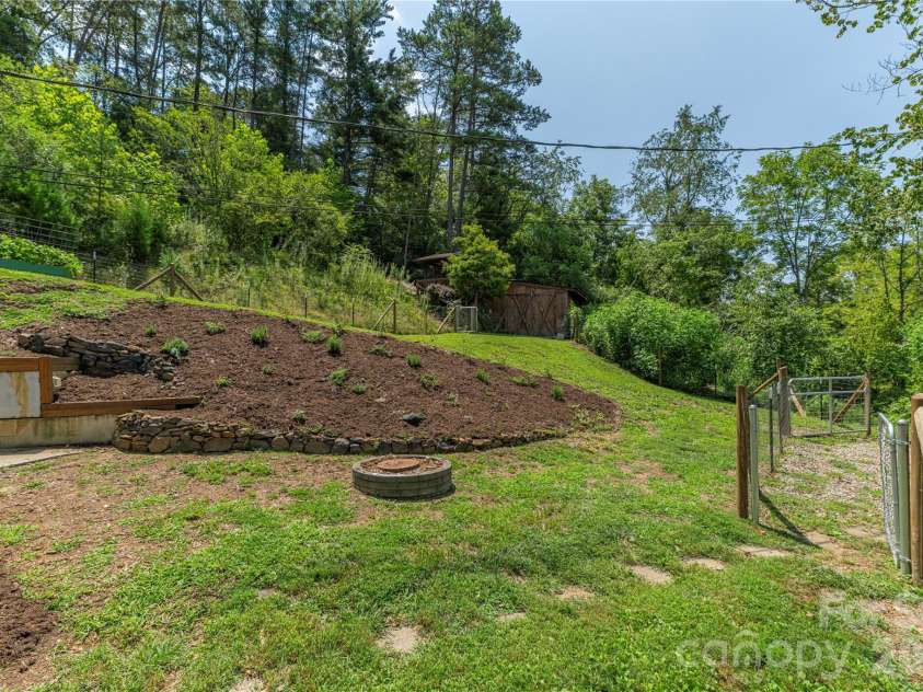 50 Embler Road, Alexander, NC 28701.  MLS# CAR4413083, YatesRealty ID 44048. Sunny fenced yard