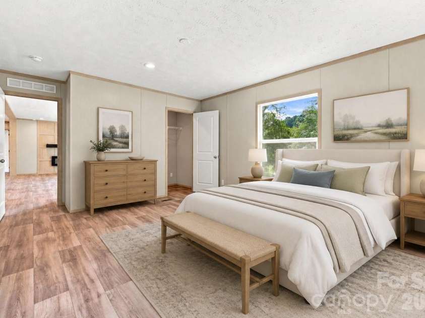 25 Caldwell Road, Waynesville, NC 28786.  MLS# CAR4414496, YatesRealty ID 44049. Virtually staged primary bedroom