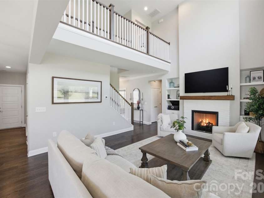 7025 Kingfisher Way, Belmont, NC 28012.  MLS# CAR4412650, YatesRealty ID 44056. Soaring ceilings- cozy fire place.