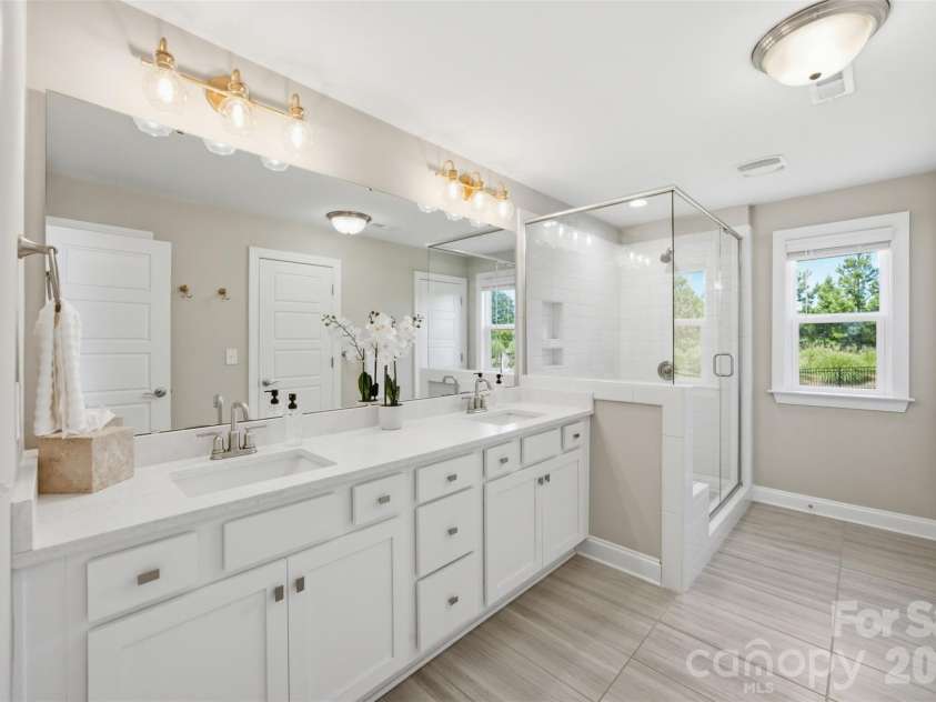 7025 Kingfisher Way, Belmont, NC 28012.  MLS# CAR4412650, YatesRealty ID 44056. Upper level- Primary suite bathroom.