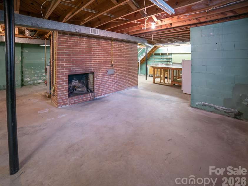 201 Woodlawn Drive, Morganton, NC 28655.  MLS# CAR4414420, YatesRealty ID 44061. Basement with third fireplace