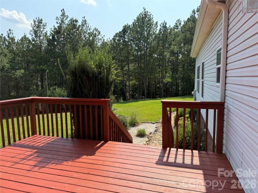 2787 Kiker Road, Peachland, NC 28133.  MLS# CAR4414095, YatesRealty ID 44069. This deck and backyard combo is something truly special.