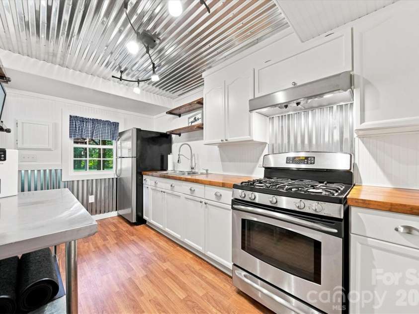 2587 Vision Drive, Catawba, NC 28609.  MLS# CAR4414475, YatesRealty ID 44079. Party shack includes a full kitchen with gas range
