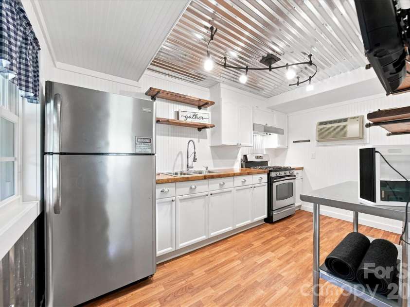 2587 Vision Drive, Catawba, NC 28609.  MLS# CAR4414475, YatesRealty ID 44079. Party shack includes a full kitchen with gas range