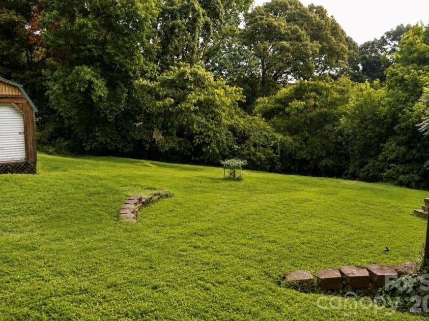 6210 Hilltop Avenue, Kannapolis, NC 28081.  MLS# CAR4412982, YatesRealty ID 44083. Backyard and shed area