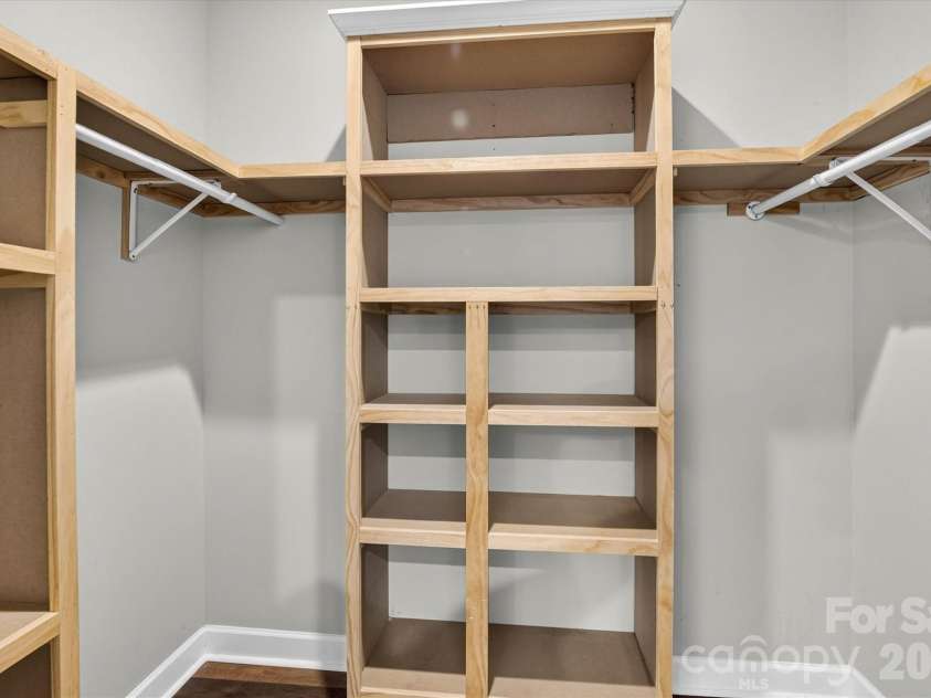 245 Eagle Creek Road, Clover, SC 29710.  MLS# CAR4414318, YatesRealty ID 44089. Walk in closet with custom shelving in Primary!
