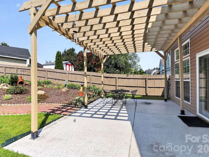 14642 Hawick Manor Lane, Pineville, NC 28134.  MLS# CAR4414256, YatesRealty ID 44101. Patio with pergola