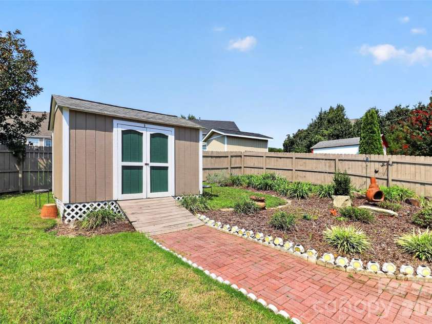 14642 Hawick Manor Lane, Pineville, NC 28134.  MLS# CAR4414256, YatesRealty ID 44101. Storage shed