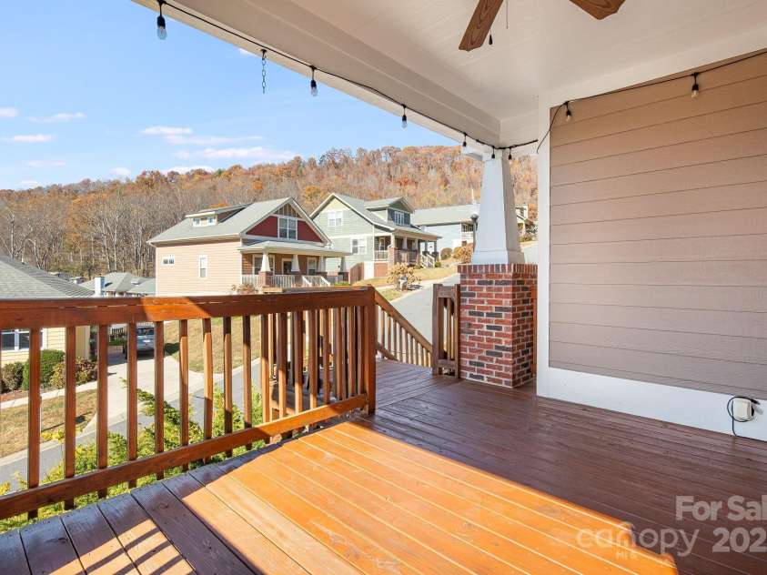 11 Byrdcliffe Lane, Asheville, NC 28805.  MLS# CAR4320731, YatesRealty ID 4411. Covered Front Porch with Mountain Views