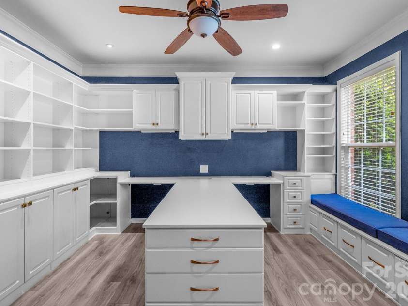 1107 Boulder Court, Waxhaw, NC 28173.  MLS# CAR4396049, YatesRealty ID 44112. Office with built-ins surrounding workspace and window bench