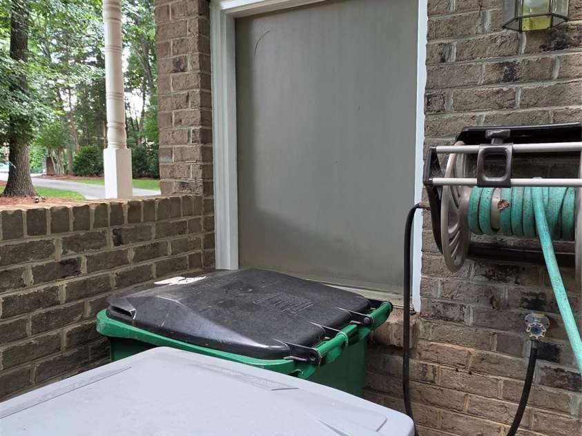 4721 Kuykendall Road, Charlotte, NC 28270.  MLS# CAR4413764, YatesRealty ID 44123. Trash Door from garage