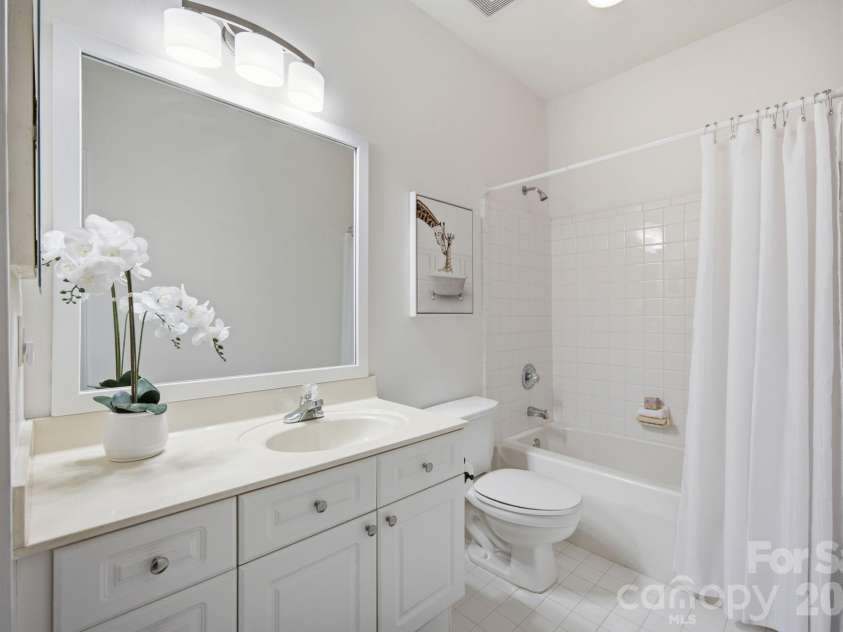 915 Northeast Drive, Davidson, NC 28036.  MLS# CAR4396238, YatesRealty ID 44126. Guest bathroom with updated vanity light