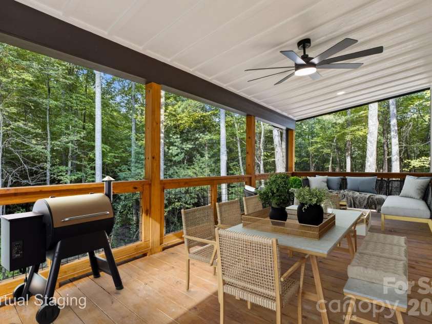 1008 Bell Mountain Road, Zirconia, NC 28790.  MLS# CAR4407045, YatesRealty ID 44128. Virtually staged covered back deck perfect for outdoor entertaining.