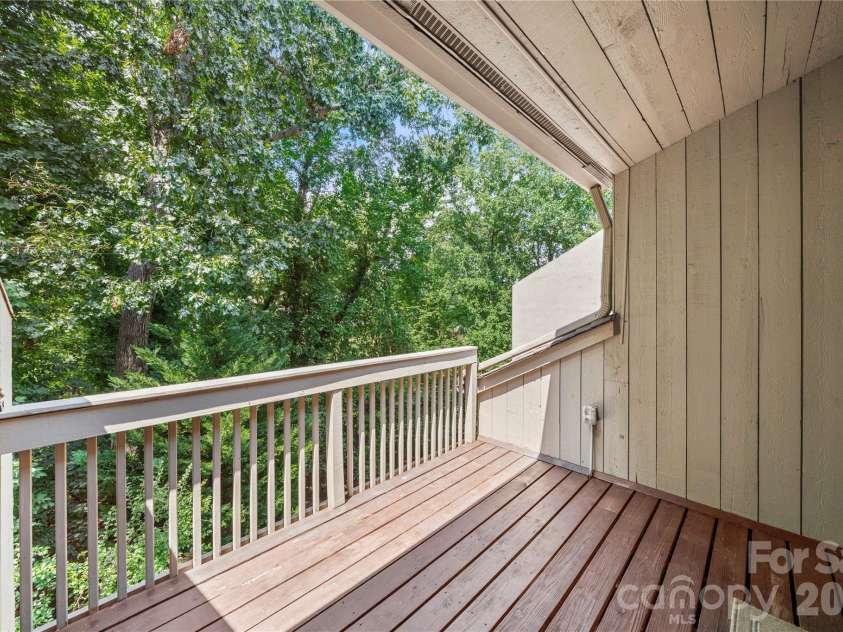 222 Riverview Terrace, Lake Wylie, SC 29710.  MLS# CAR4411366, YatesRealty ID 44151. Covered deck off of primary bedroom