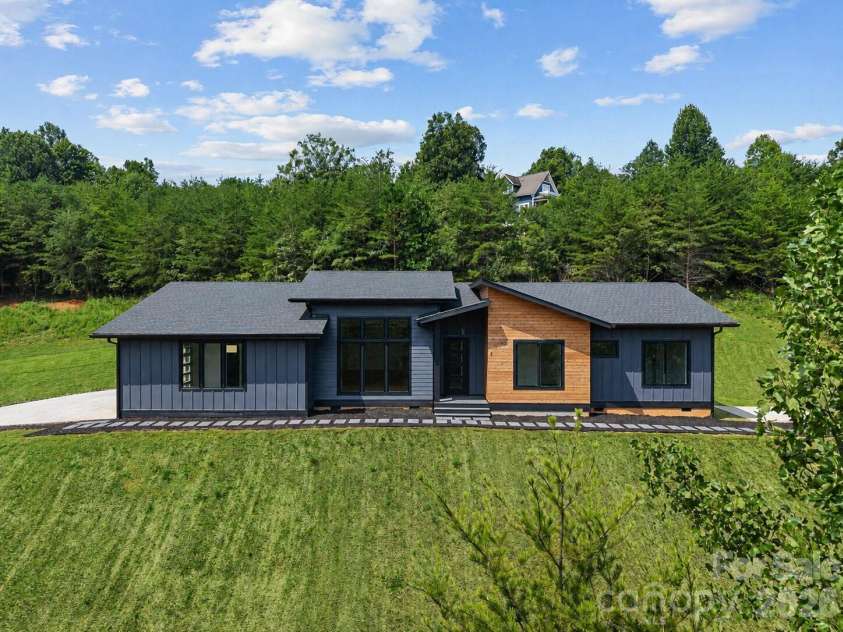 7 Spicebush Lane, Weaverville, NC 28787.  MLS# CAR4414124, YatesRealty ID 44164. Virtually enhanced grass