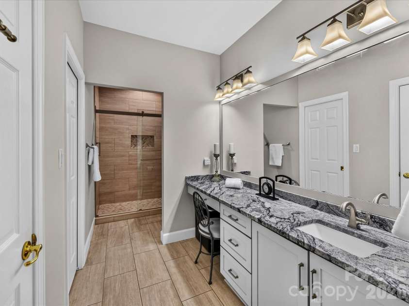8316 Olde Troon Drive, Charlotte, NC 28277.  MLS# CAR4413453, YatesRealty ID 44176. Primary bath with updated shower, flooring, vanity and countertops