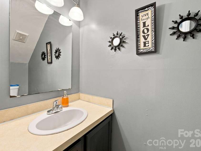 5512 River Falls Drive, Charlotte, NC 28215.  MLS# CAR4413301, YatesRealty ID 44180. Downstairs half bath