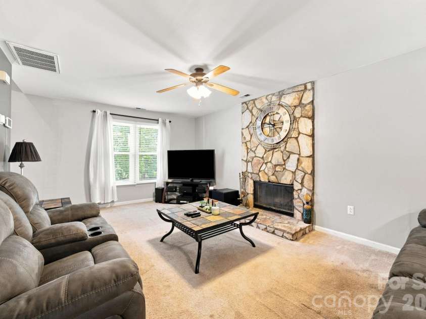 5512 River Falls Drive, Charlotte, NC 28215.  MLS# CAR4413301, YatesRealty ID 44180. Living room with fireplace