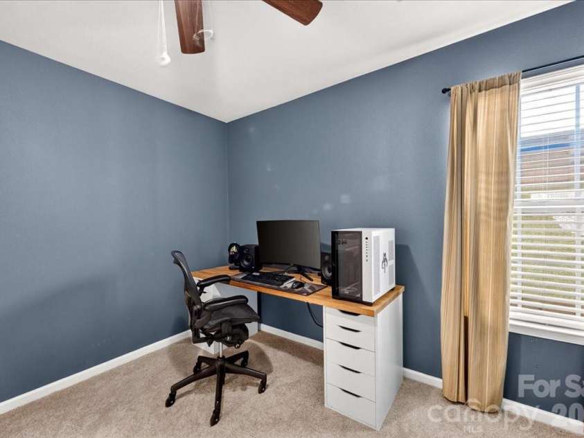 4033 Long Arrow Drive, Concord, NC 28025.  MLS# CAR4412395, YatesRealty ID 44208. Main level guest bedroom