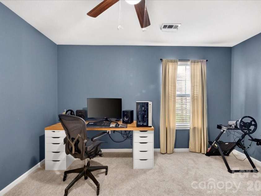 4033 Long Arrow Drive, Concord, NC 28025.  MLS# CAR4412395, YatesRealty ID 44208. Main level guest bedroom