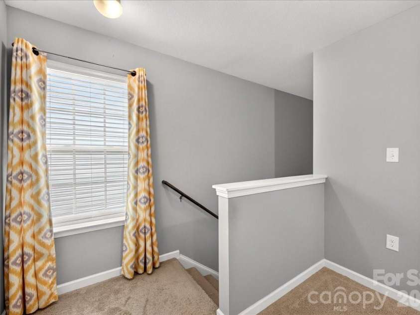 4033 Long Arrow Drive, Concord, NC 28025.  MLS# CAR4412395, YatesRealty ID 44208. Second level landing