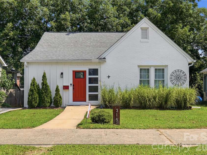 315 Pendleton Street, Rock Hill, SC 29730.  MLS# CAR4412482, YatesRealty ID 44209. Board and batten siding and whitewashed brick give this Old Town Rock Hill home instant curb appeal.