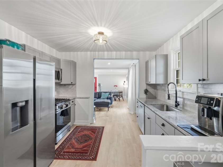 315 Pendleton Street, Rock Hill, SC 29730.  MLS# CAR4412482, YatesRealty ID 44209. The kitchen opens directly into the living and dining space, making it easy to stay connected while cooking or entertaining.