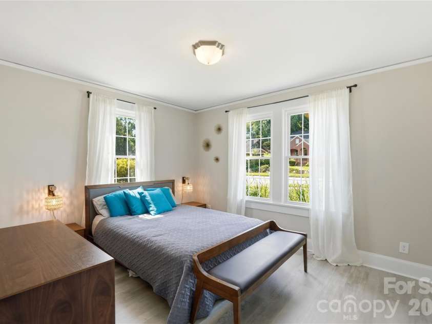 315 Pendleton Street, Rock Hill, SC 29730.  MLS# CAR4412482, YatesRealty ID 44209. This front bedroom is filled with natural light from two large windows, with a bright, airy feel throughout.