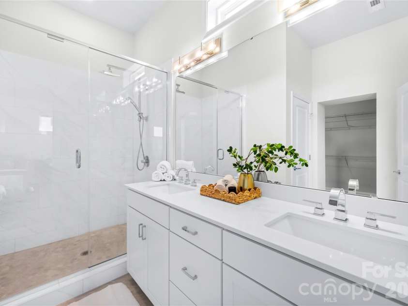 5919 Ardrey Kell Road, Charlotte, NC 28277.  MLS# CAR4411424, YatesRealty ID 44225. Beautiful seamless shower + dual sinks in primary bath