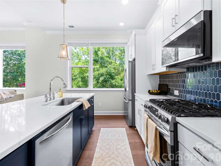 5919 Ardrey Kell Road, Charlotte, NC 28277.  MLS# CAR4411424, YatesRealty ID 44225. Quartz counters + tile backsplash + gas range