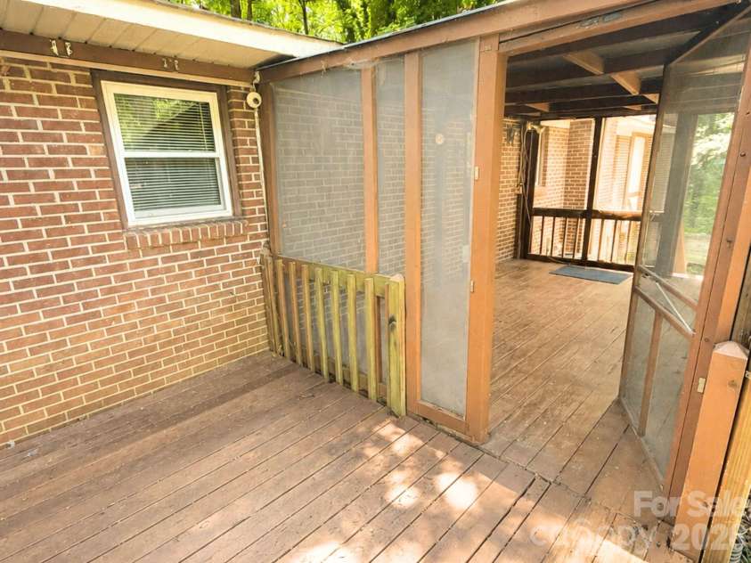 101 Sherry Drive, Stanley, NC 28164.  MLS# CAR4410482, YatesRealty ID 44231. Back deck with enclosure