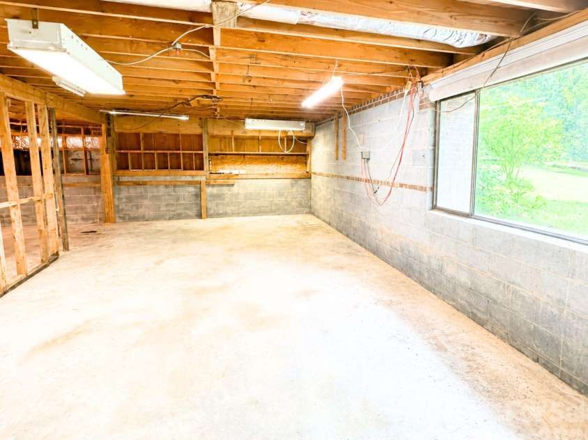 101 Sherry Drive, Stanley, NC 28164.  MLS# CAR4410482, YatesRealty ID 44231. Unfinished basement