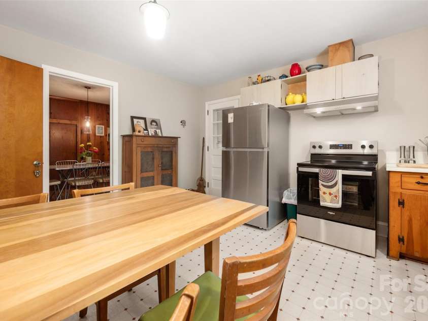2911 Enfield Road, Charlotte, NC 28205.  MLS# CAR4407774, YatesRealty ID 44249. Kitchen With New Stainless Vent and Electric Range and Stainless Refrigerator