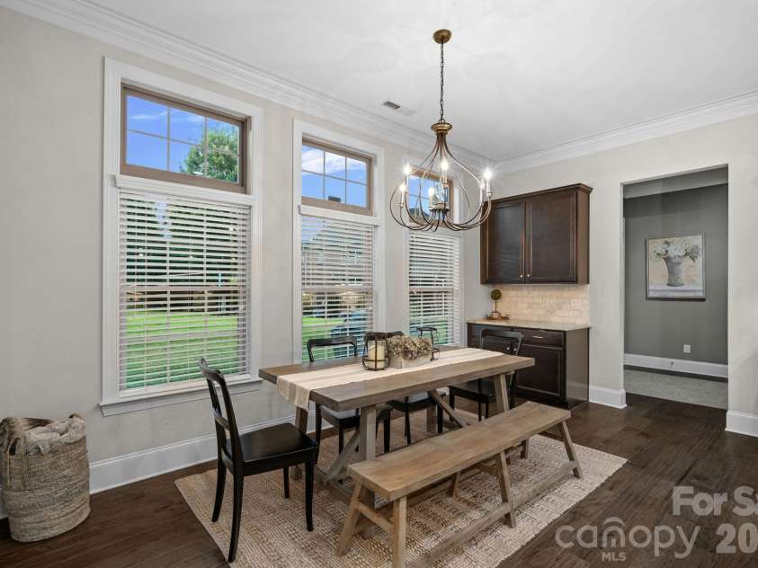 8211 Caesars Head Drive, Waxhaw, NC 28173.  MLS# CAR4408223, YatesRealty ID 44252. Breakfast area overlooking backyard