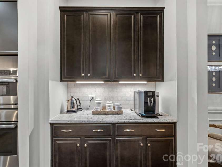 8211 Caesars Head Drive, Waxhaw, NC 28173.  MLS# CAR4408223, YatesRealty ID 44252. Butler's pantry between kitchen and dining room