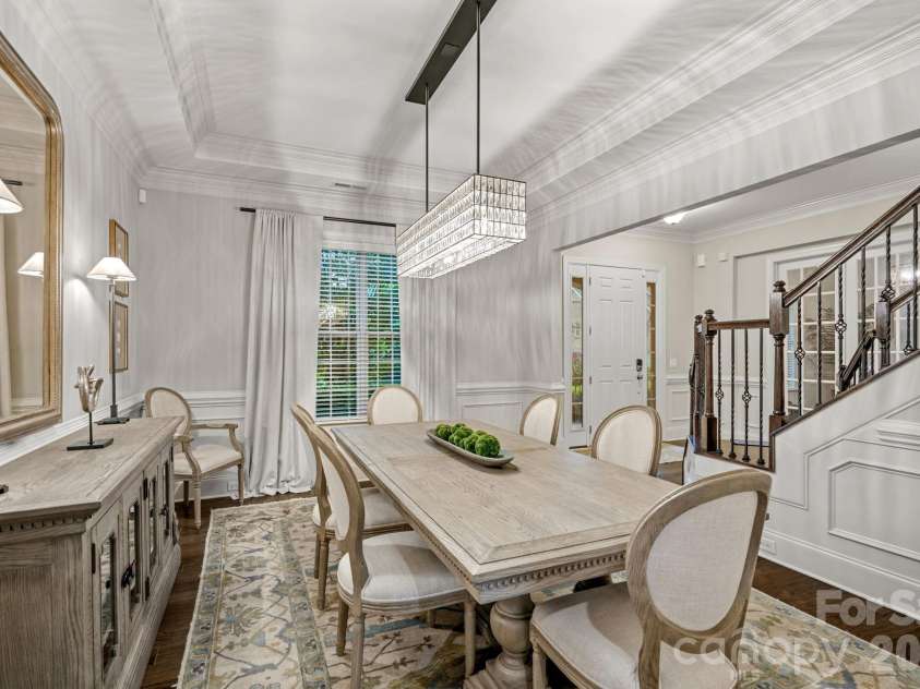 8211 Caesars Head Drive, Waxhaw, NC 28173.  MLS# CAR4408223, YatesRealty ID 44252. Classic Dining room with tray ceilings and updated lighting