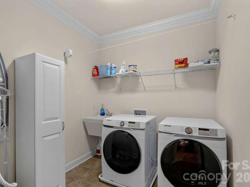 8211 Caesars Head Drive, Waxhaw, NC 28173.  MLS# CAR4408223, YatesRealty ID 44252. Laundry room upper level with sink