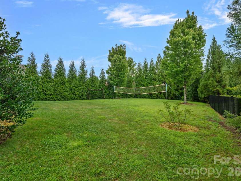 8211 Caesars Head Drive, Waxhaw, NC 28173.  MLS# CAR4408223, YatesRealty ID 44252. Lovely backyard with mature privacy trees