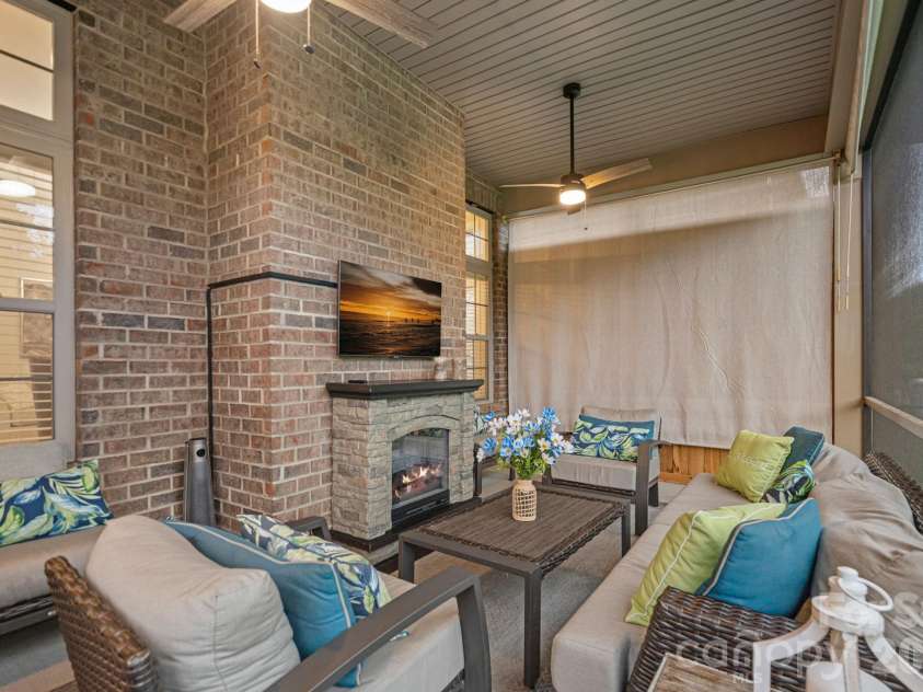 8211 Caesars Head Drive, Waxhaw, NC 28173.  MLS# CAR4408223, YatesRealty ID 44252. Screened back porch with fireplace!
