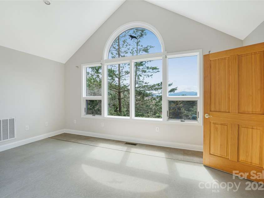 225 Seasons Drive, Clyde, NC 28721.  MLS# CAR4234231, YatesRealty ID 4426. Primary bedroom