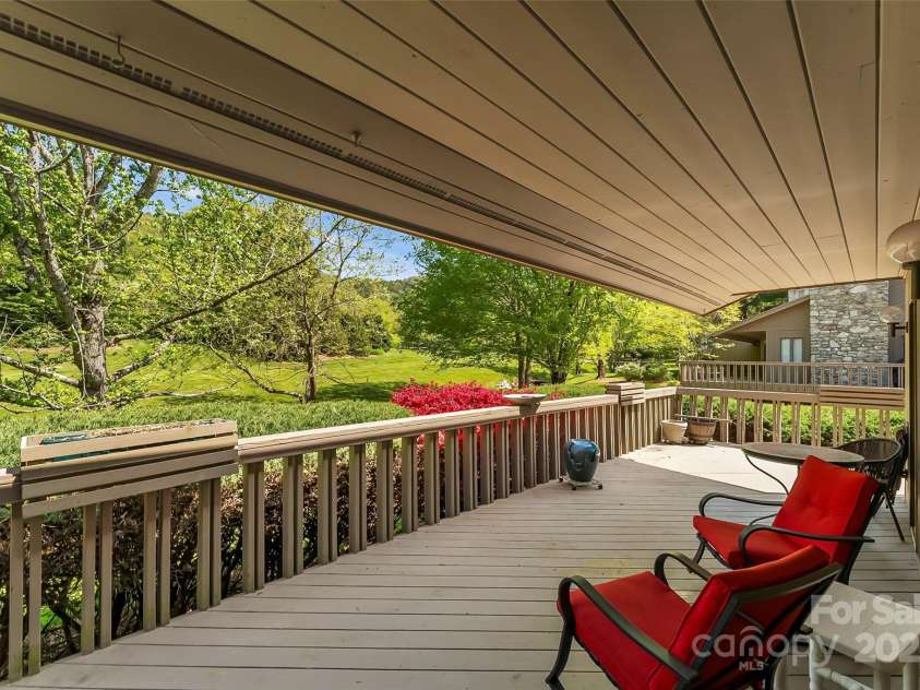 10 Clubside Drive, Asheville, NC 28804.  MLS# CAR4214274, YatesRealty ID 4427. Covered Wrap Around Deck Facing Creek