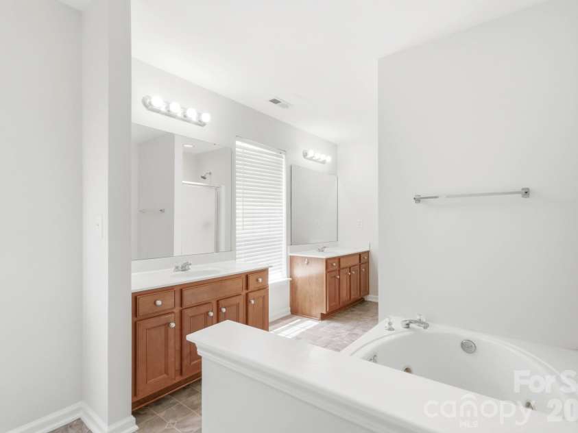 4010 Lawrence Daniel Drive, Matthews, NC 28104.  MLS# CAR4410182, YatesRealty ID 44275. Primary Bathroom with Separate Shower