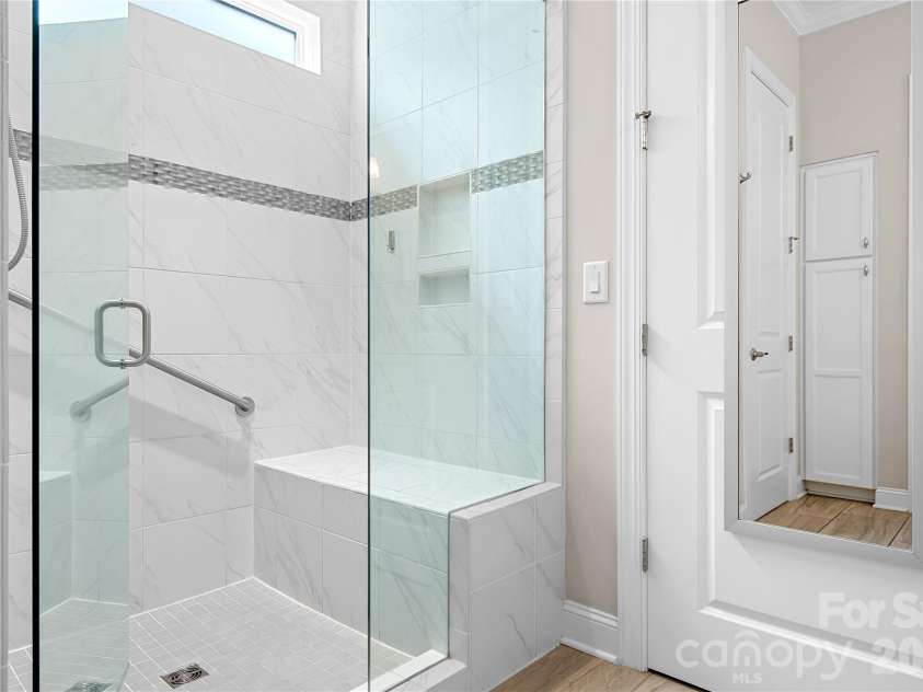 218 Stone Mountain Way, Denver, NC 28037.  MLS# CAR4402089, YatesRealty ID 44285. Master Bathroom Shower Has Bench