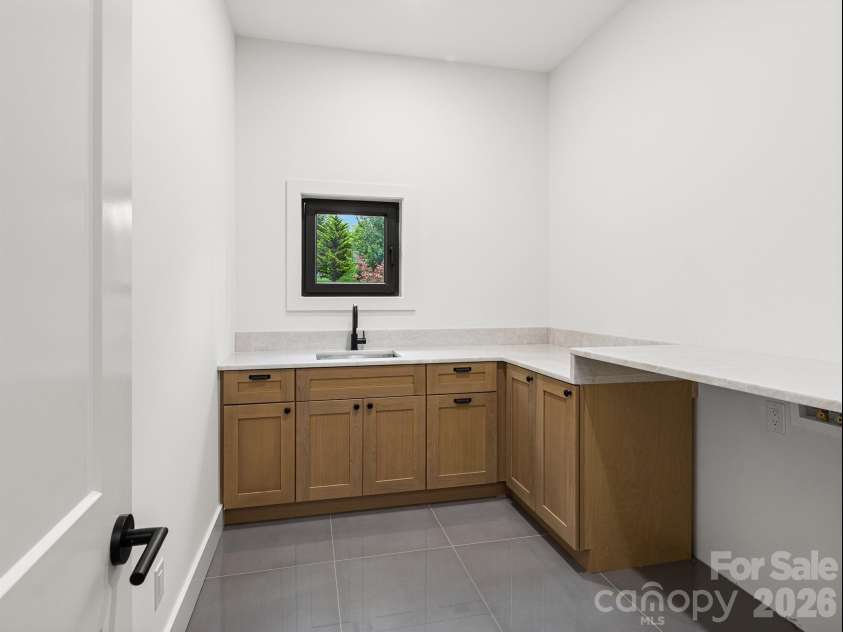 25 Copper Mill Court, Candler, NC 28715.  MLS# CAR4413961, YatesRealty ID 44287. Laundry room