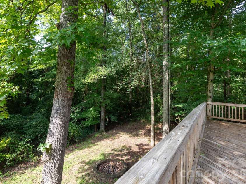 820 Clearview Court, Concord, NC 28025.  MLS# CAR4414589, YatesRealty ID 44296. Deck and backyard