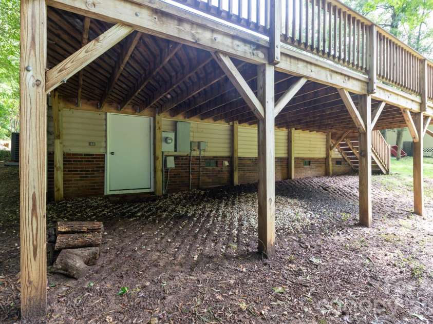 820 Clearview Court, Concord, NC 28025.  MLS# CAR4414589, YatesRealty ID 44296. Deck and crawlspace access.