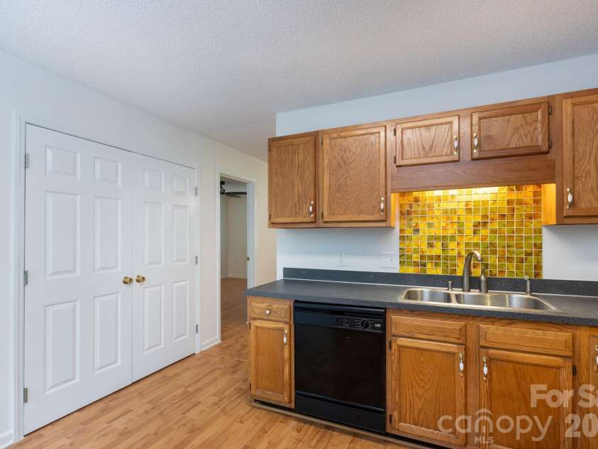 820 Clearview Court, Concord, NC 28025.  MLS# CAR4414589, YatesRealty ID 44296. Kitchen with large laundry closet