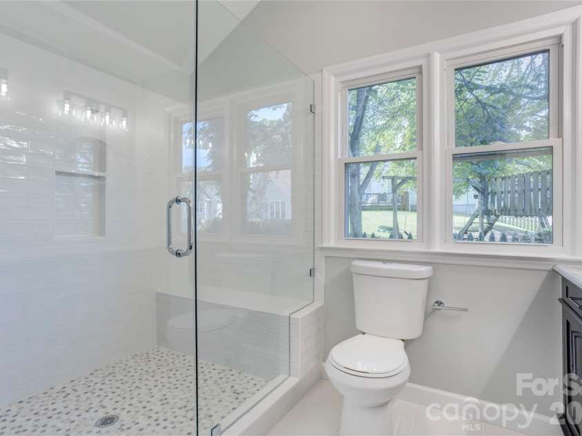 156 Edgewater Drive, Concord, NC 28027.  MLS# CAR4413561, YatesRealty ID 44298. Beautifully updated primary bath with huge step in shower