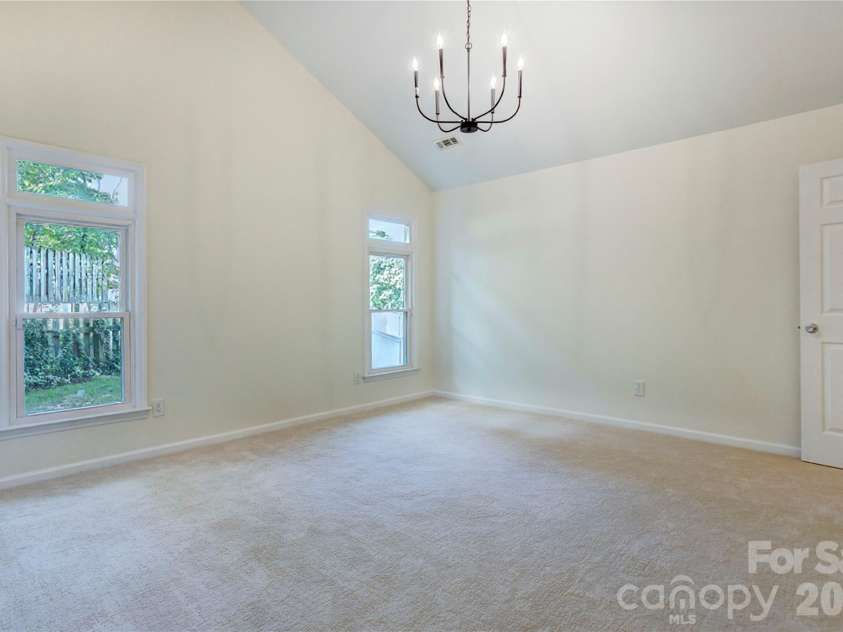 156 Edgewater Drive, Concord, NC 28027.  MLS# CAR4413561, YatesRealty ID 44298. Primary bedroom with high ceilings and updated lighting